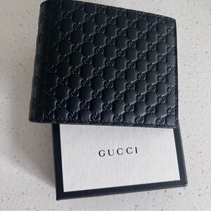 Gucci Mens Black Leather micro Guccissima GG embossed bi-fold wallet